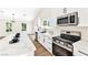 Bright kitchen with stainless steel appliances and plenty of countertop space at 811 Spyglass Ln, Las Vegas, NV 89107