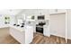 Modern kitchen features stainless steel appliances, island, and ample counter space at 811 Spyglass Ln, Las Vegas, NV 89107
