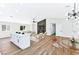 Open-concept living area boasts sleek floors, modern fireplace, and vaulted ceilings at 811 Spyglass Ln, Las Vegas, NV 89107