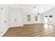 Bright, inviting living space with double doors, wood floors, recessed lighting, and modern fixture at 811 Spyglass Ln, Las Vegas, NV 89107