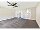 This primary bedroom boasts walk in closet, neutral walls, modern fan, and a connected bathroom at 811 Spyglass Ln, Las Vegas, NV 89107