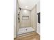 This bathroom features sleek stone shower with a rainfall shower head and a modern niche at 811 Spyglass Ln, Las Vegas, NV 89107
