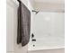 This bathroom features a black rainfall shower head, and sleek white subway tile surround at 811 Spyglass Ln, Las Vegas, NV 89107
