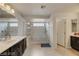 Bathroom featuring a double vanity and a large glass-enclosed shower with stylish tile and fixtures at 8176 Duncan Peak Ct, Las Vegas, NV 89139