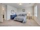 Inviting bedroom with plantation shutters, soft carpet, and an ensuite bathroom for convenience at 8176 Duncan Peak Ct, Las Vegas, NV 89139