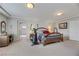 Generously sized main bedroom with a workout space, desk, and easy access to the Primary bathroom at 8176 Duncan Peak Ct, Las Vegas, NV 89139