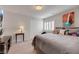 Cozy bedroom with a comfortable bed, neutral color palette, and a window with shutters at 8176 Duncan Peak Ct, Las Vegas, NV 89139