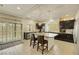 Bright kitchen features an island with bar seating, stainless steel appliances, and modern lighting at 8176 Duncan Peak Ct, Las Vegas, NV 89139