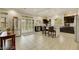 Open-concept kitchen with granite counters, stainless appliances, central island, and adjacent living space at 8176 Duncan Peak Ct, Las Vegas, NV 89139