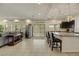 Spacious kitchen boasts tile flooring, stainless steel appliances, and large island seating area at 8176 Duncan Peak Ct, Las Vegas, NV 89139