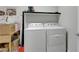 Efficient laundry room with a modern washer and dryer and space for storage at 8176 Duncan Peak Ct, Las Vegas, NV 89139