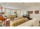 Bright living room featuring tile floors, comfortable furniture, and sunlit windows at 8176 Duncan Peak Ct, Las Vegas, NV 89139