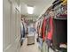 Spacious walk-in closet featuring ample shelving, hanging rods, and storage for all your wardrobe needs at 8176 Duncan Peak Ct, Las Vegas, NV 89139