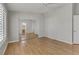 This bedroom showcases ample space with wood floors, a ceiling fan, and a mirrored closet at 8450 Alta Dr # 220, Las Vegas, NV 89145