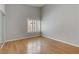 The spacious bedroom offers bright natural light, hardwood floors, and neutral walls at 8450 Alta Dr # 220, Las Vegas, NV 89145