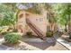 Charming condo complex with well-maintained landscaping and inviting entrance stairwell at 8450 Alta Dr # 220, Las Vegas, NV 89145