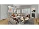 Bright living room features modern furniture, plantation shutters and a cozy fireplace at 8450 Alta Dr # 220, Las Vegas, NV 89145