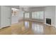 Bright living room with wood floors, a fireplace, and many windows at 8450 Alta Dr # 220, Las Vegas, NV 89145
