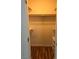 A walk-in closet with wood flooring, shelving, and a clothing rack at 8977 Melridge Rd, Las Vegas, NV 89148