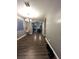 Hallway with hardwood floors leading to a living room and open concept kitchen at 8977 Melridge Rd, Las Vegas, NV 89148