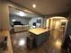 Open concept kitchen with island, stainless steel appliances, and breakfast bar at 8977 Melridge Rd, Las Vegas, NV 89148