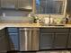 Kitchen features stainless steel dishwasher, ample counter space, and modern cabinetry at 8977 Melridge Rd, Las Vegas, NV 89148