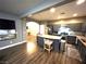 Spacious kitchen with island seating flows into other living areas, great for entertaining at 8977 Melridge Rd, Las Vegas, NV 89148