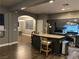 Open concept living and kitchen areas featuring stainless steel appliances and island seating at 8977 Melridge Rd, Las Vegas, NV 89148