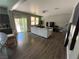 Open-concept living and dining area with sliding doors that allows natural light and outdoor access at 8977 Melridge Rd, Las Vegas, NV 89148