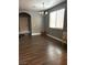 Entry way leads to a living room with lots of natural light and hardwood floors at 8977 Melridge Rd, Las Vegas, NV 89148