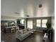 Spacious living room with a sofa and an open view of the adjacent kitchen area at 8977 Melridge Rd, Las Vegas, NV 89148