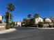 This street features sidewalks, palm trees, and neighborhood signs at 8977 Melridge Rd, Las Vegas, NV 89148