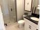 This contemporary bathroom features a sleek shower, modern vanity, and stylish fixtures at 933 Hunter Shores Ave, North Las Vegas, NV 89084