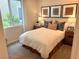 This modern bedroom offers lots of natural light with unique decorations and neutral tones at 933 Hunter Shores Ave, North Las Vegas, NV 89084