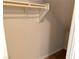 A walk-in closet with an angled ceiling and a wooden clothes bar at 933 Hunter Shores Ave, North Las Vegas, NV 89084