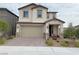 Charming two-story home with a neutral color palette, landscaped yard, and a two car garage at 933 Hunter Shores Ave, North Las Vegas, NV 89084