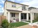 Beautiful two-story home with a balcony, covered patio, and well-manicured backyard at 933 Hunter Shores Ave, North Las Vegas, NV 89084