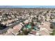 Overhead view of backyards featuring pools, landscaping, and patio areas at 9562 Collinsleap Ct, Las Vegas, NV 89123