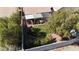 Aerial view of a backyard with grass, landscaping, trees and covered patio at 9562 Collinsleap Ct, Las Vegas, NV 89123