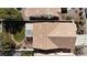 Aerial view of the backyard and covered patio, surrounded by mature landscaping at 9562 Collinsleap Ct, Las Vegas, NV 89123