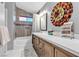 Bathroom featuring quartz countertop, bathtub, and modern design at 9562 Collinsleap Ct, Las Vegas, NV 89123