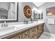 Bathroom featuring double sinks, a quartz countertop, and attractive modern fixtures at 9562 Collinsleap Ct, Las Vegas, NV 89123