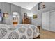Bedroom featuring natural light, gray walls, and a stylish interior design at 9562 Collinsleap Ct, Las Vegas, NV 89123