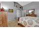 Comfortable bedroom with modern decor, neutral colors, and a well-organized closet at 9562 Collinsleap Ct, Las Vegas, NV 89123