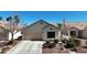Charming single-story home with a well-maintained front yard and attached garage at 9562 Collinsleap Ct, Las Vegas, NV 89123