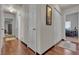 Hallway with fresh neutral paint, striking floors, and doors to other rooms at 9562 Collinsleap Ct, Las Vegas, NV 89123