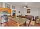 Open kitchen with granite countertops and island overlooking the living room at 9562 Collinsleap Ct, Las Vegas, NV 89123