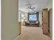 Cozy living room with carpet flooring, a ceiling fan, and a comfortable sofa at 9562 Collinsleap Ct, Las Vegas, NV 89123
