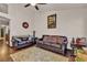 Cozy living room featuring hardwood floors, contemporary decor, and comfortable seating at 9562 Collinsleap Ct, Las Vegas, NV 89123