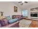 Comfortable living room with plush seating, area rug, and built-in media center at 9562 Collinsleap Ct, Las Vegas, NV 89123